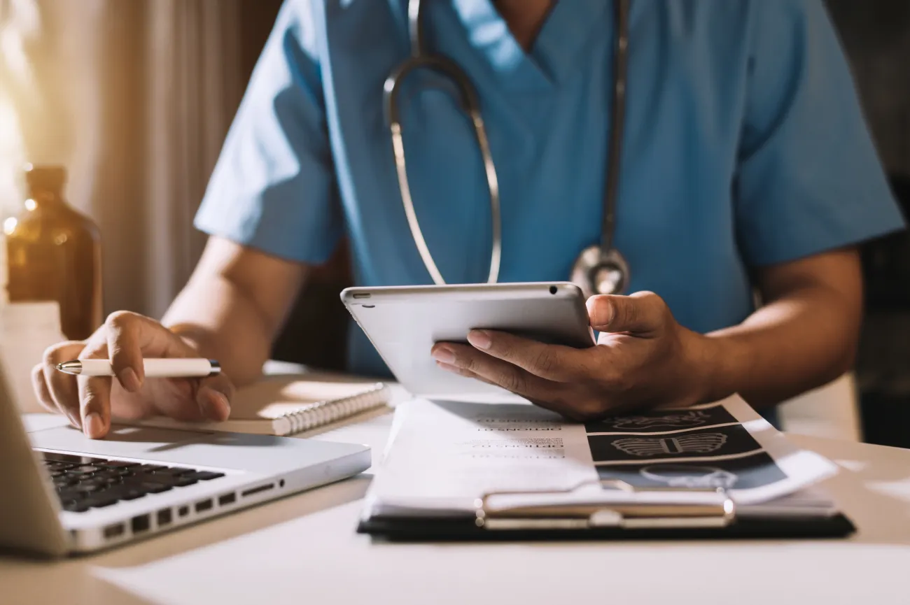 Stock image of a doctor looking at patient details