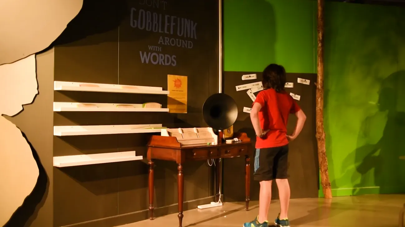 A child standing in front of the Gobblefunk machine