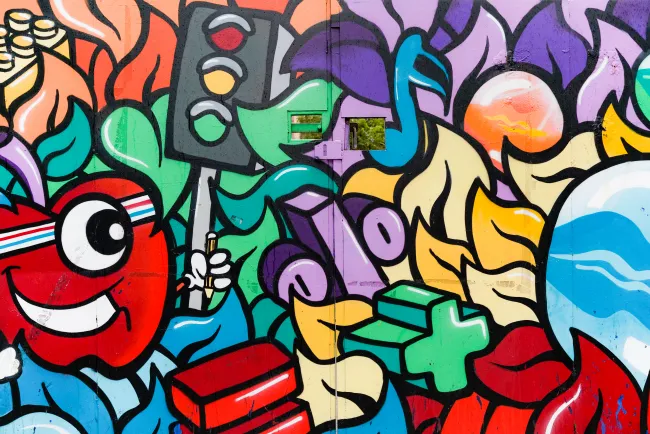 Colourful street art on a wall in Whitechapel