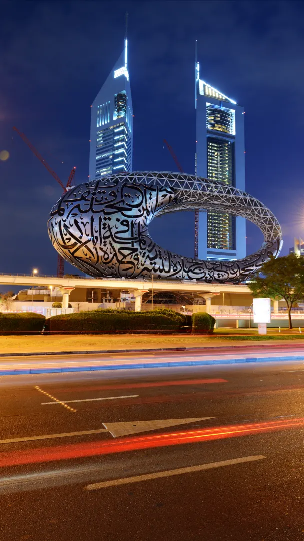 External shot of the Museum of the Future in Dubai, timelapse photo taken at night